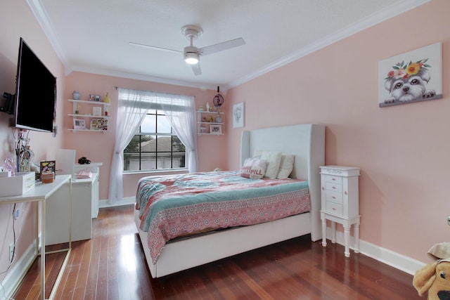 bedroom featuring a ceiling fan, crown molding, baseboards, and wood finished floors