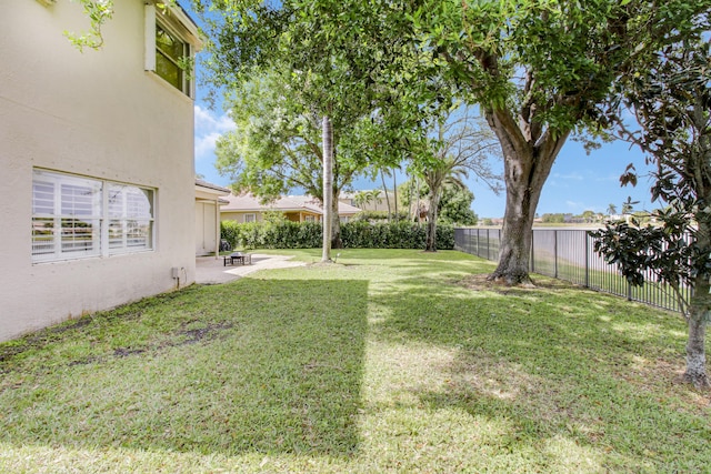 view of yard with a patio area and a fenced backyard