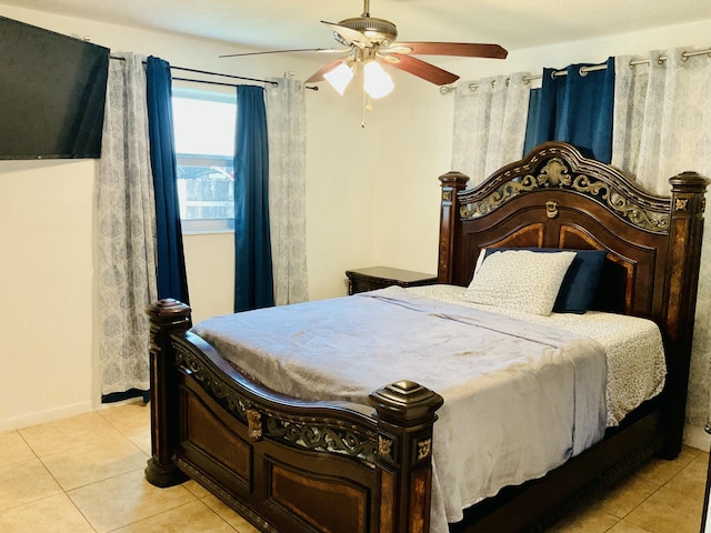 bedroom with light tile patterned floors and ceiling fan