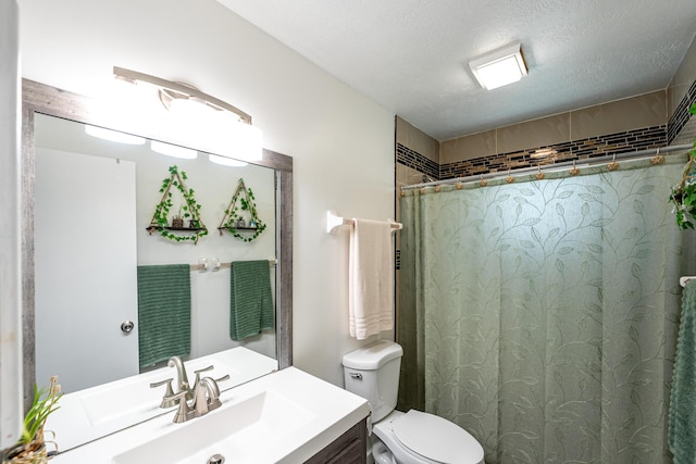 full bath featuring a shower, toilet, vanity, and a textured ceiling