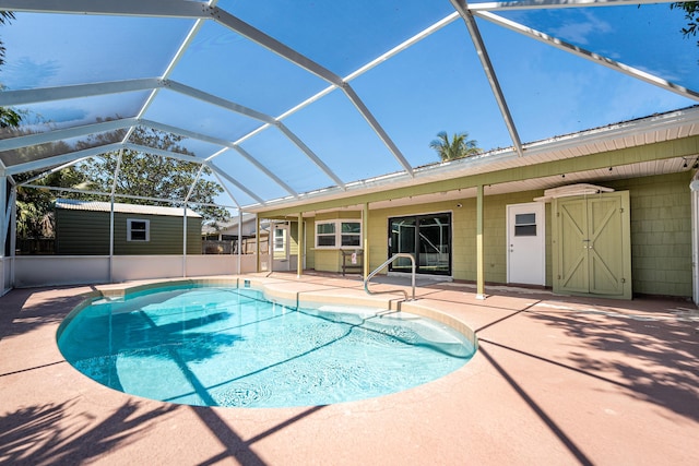 pool with a lanai and a patio