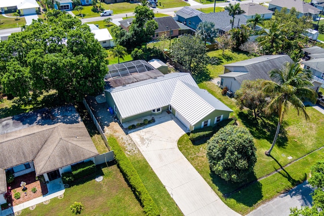 birds eye view of property with a residential view