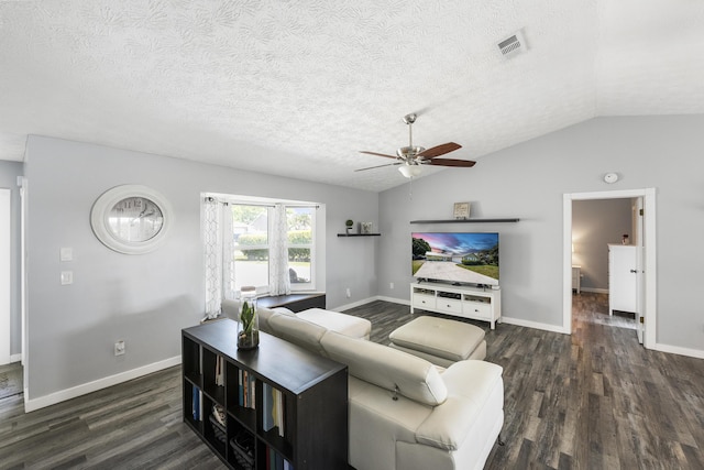 living room featuring dark wood-style floors, visible vents, ceiling fan, vaulted ceiling, and a textured ceiling