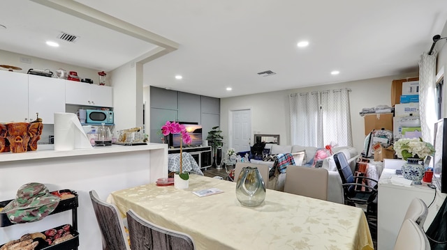 dining space with recessed lighting and visible vents