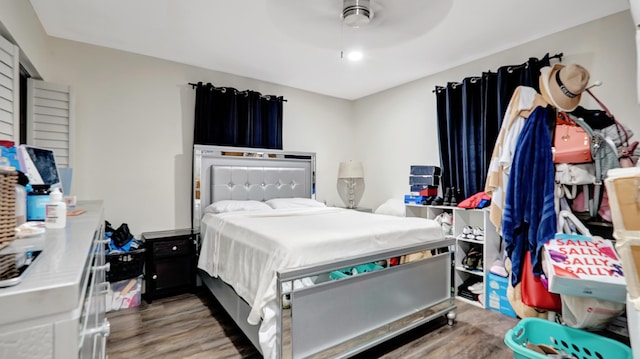 bedroom with ceiling fan and wood finished floors