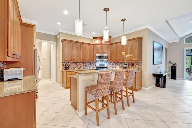 kitchen with light tile patterned floors, a center island, stainless steel appliances, and tasteful backsplash