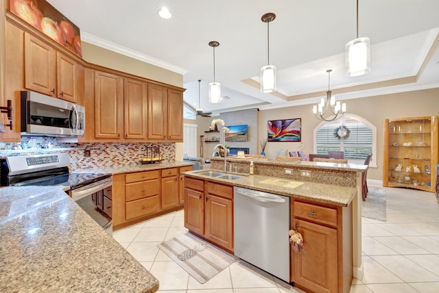 kitchen with a sink, tasteful backsplash, stainless steel appliances, crown molding, and light tile patterned floors