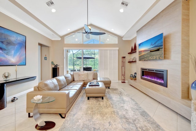 tiled living room featuring visible vents, ceiling fan, a tile fireplace, and vaulted ceiling