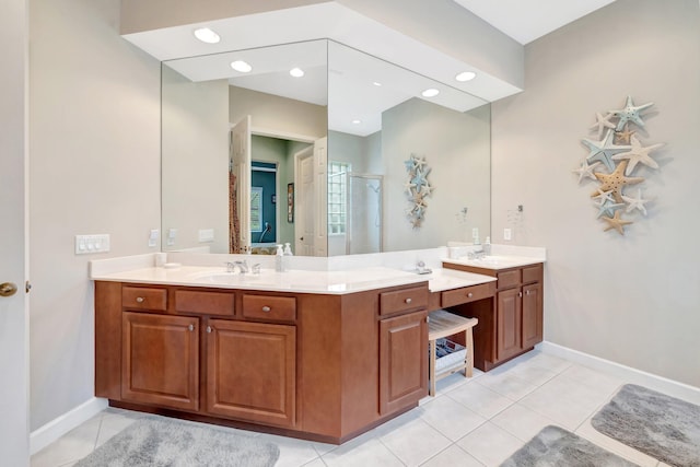 full bath with vanity, baseboards, recessed lighting, a shower stall, and tile patterned floors