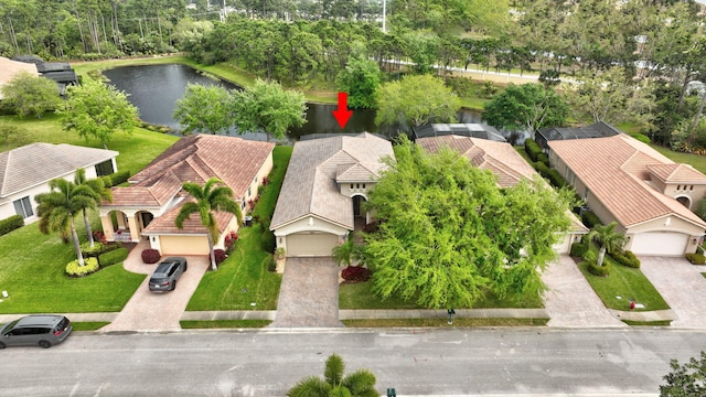 birds eye view of property with a water view