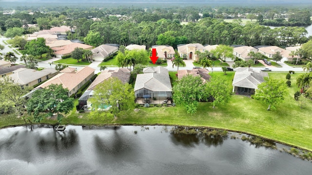 birds eye view of property with a residential view and a water view