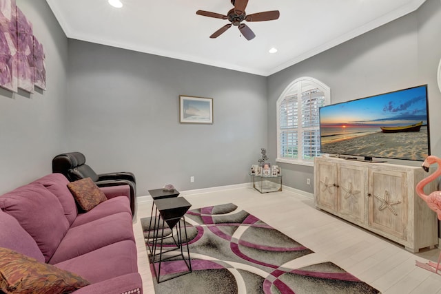 living area with wood finished floors, baseboards, recessed lighting, ceiling fan, and ornamental molding