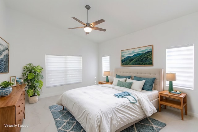 bedroom featuring vaulted ceiling, a ceiling fan, baseboards, and marble finish floor