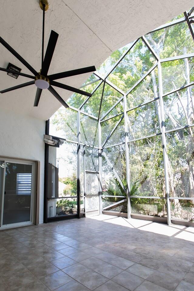 exterior space with ceiling fan