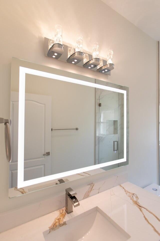 full bathroom with vanity and a stall shower