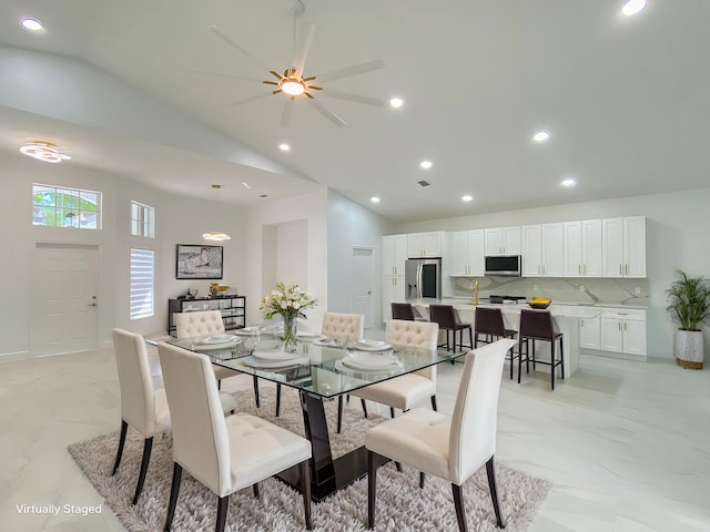 dining room with high vaulted ceiling, recessed lighting, marble finish floor, and ceiling fan
