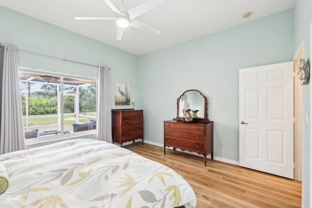 bedroom with a ceiling fan, light wood-type flooring, access to outside, and baseboards