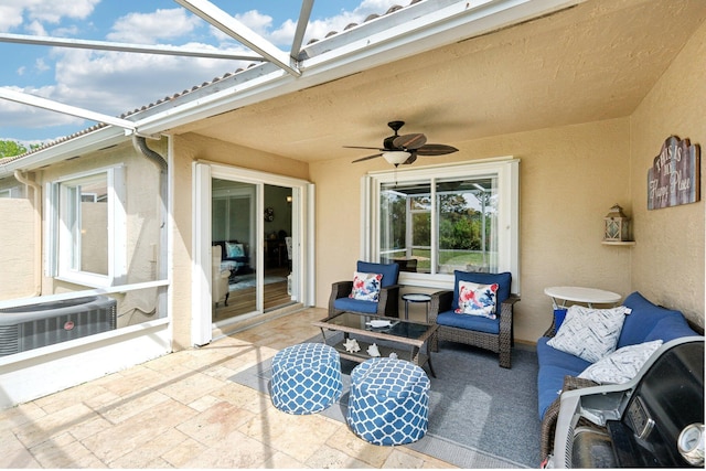 view of patio / terrace with central air condition unit, glass enclosure, ceiling fan, and outdoor lounge area