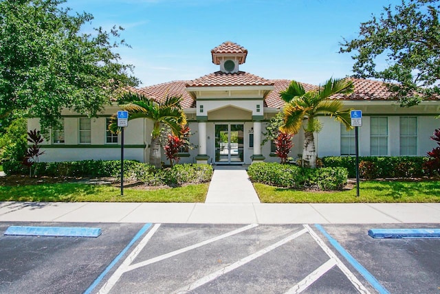 view of property featuring uncovered parking