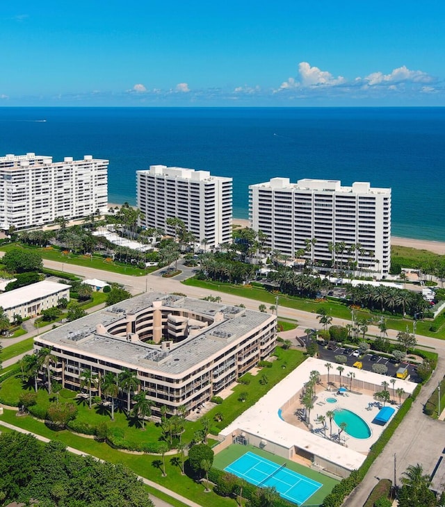 birds eye view of property featuring a water view and a city view