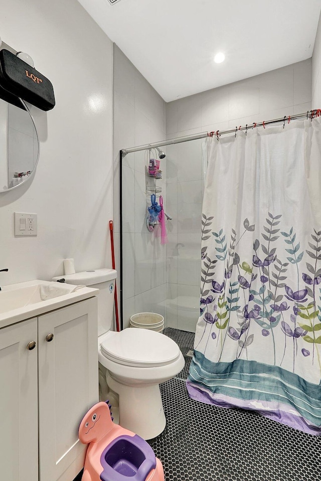 full bath with toilet, a shower stall, and vanity