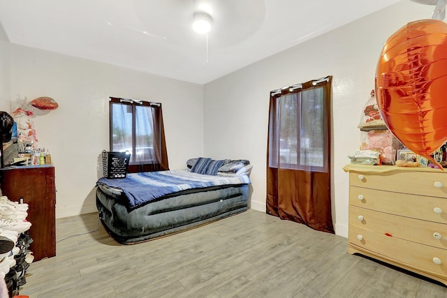 bedroom featuring ceiling fan and wood finished floors