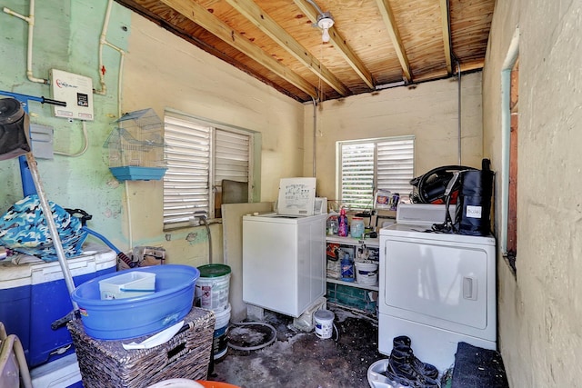 clothes washing area featuring laundry area and washing machine and clothes dryer