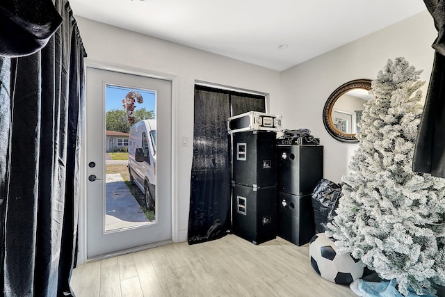 doorway featuring wood finished floors