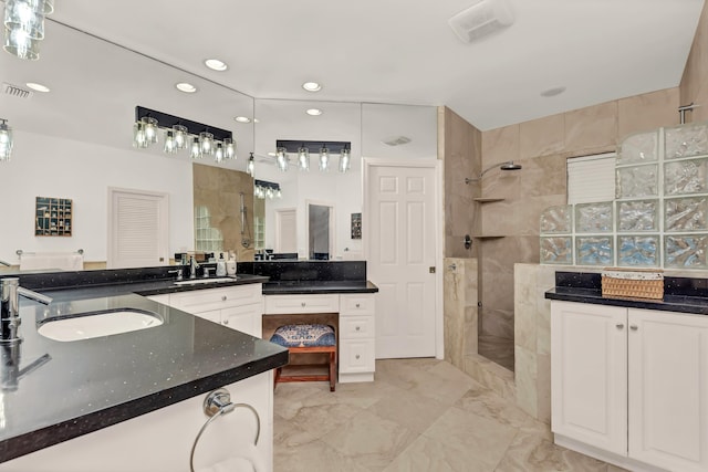 full bath featuring vanity, marble finish floor, a walk in shower, visible vents, and recessed lighting
