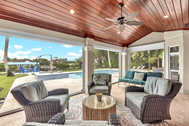 view of patio / terrace with an outdoor pool, an outdoor living space, and a ceiling fan