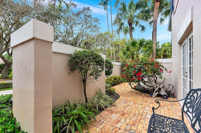 view of patio / terrace featuring fence