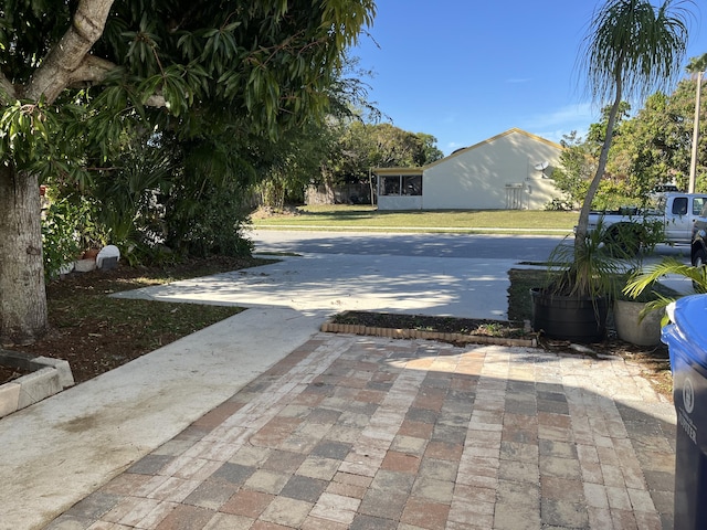 view of street featuring driveway