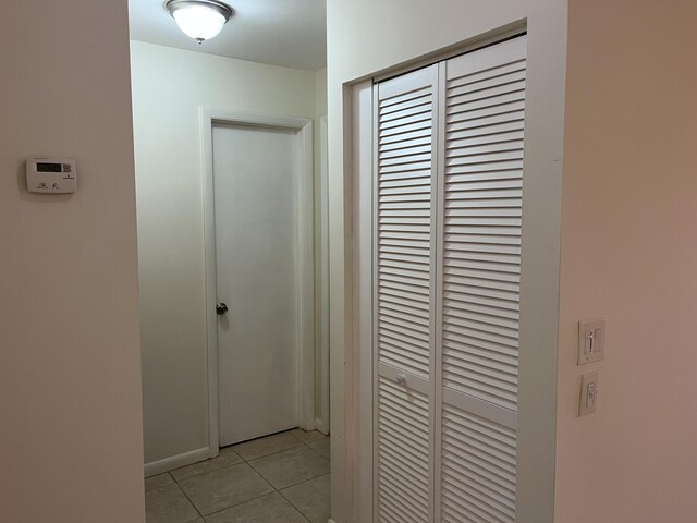 hallway with light tile patterned flooring