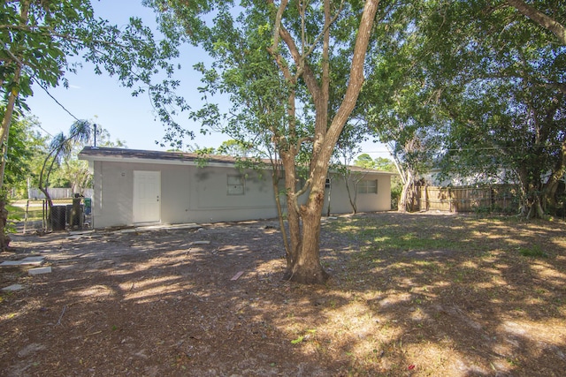 rear view of house with fence