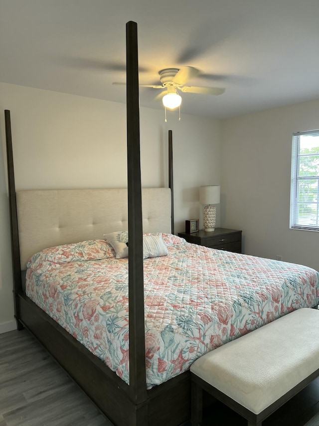 bedroom with a ceiling fan and wood finished floors