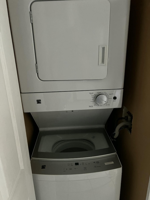 laundry room featuring laundry area and stacked washing maching and dryer