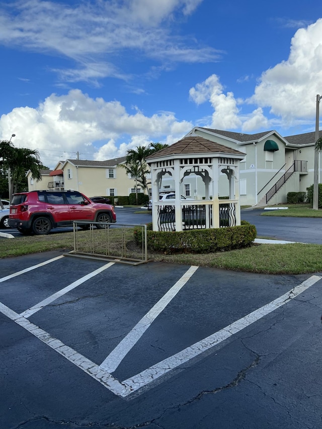 uncovered parking lot with a residential view