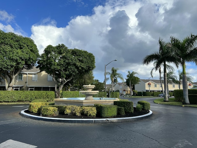 view of road featuring street lights and a residential view