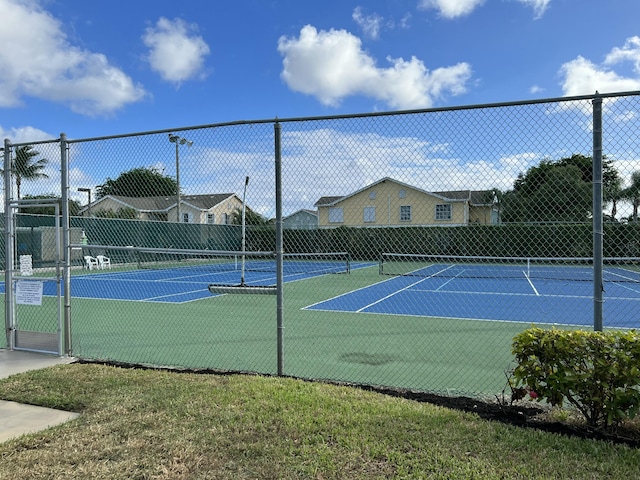 view of sport court with fence