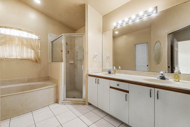 bathroom with a bath, tile patterned flooring, a sink, and a shower stall