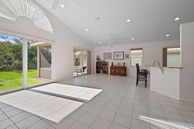 3190 SE Carrick Green Ct, Port Saint Lucie, FL 34952 - living room with a ceiling fan, light tile patterned floors, recessed lighting, high vaulted ceiling, and baseboards