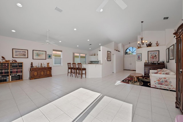 3190 SE Carrick Green Ct, Port Saint Lucie, FL 34952 - foyer entrance with ceiling fan, plenty of natural light, light tile patterned floors, recessed lighting, and high vaulted ceiling