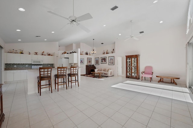 3190 SE Carrick Green Ct, Port Saint Lucie, FL 34952 - dining room with a ceiling fan, high vaulted ceiling, and recessed lighting