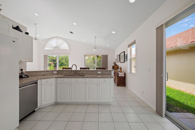 3190 SE Carrick Green Ct, Port Saint Lucie, FL 34952 - kitchen with a sink, stainless steel dishwasher, ceiling fan, lofted ceiling, and freestanding refrigerator