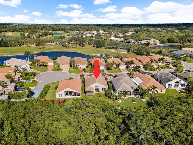 3190 SE Carrick Green Ct, Port Saint Lucie, FL 34952 - aerial view of residential area featuring a nearby body of water, a golf club, and a tree filled landscape