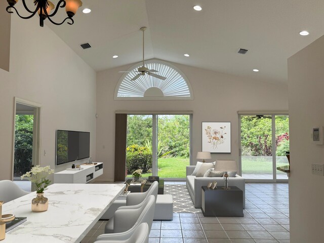 3190 SE Carrick Green Ct, Port Saint Lucie, FL 34952 - living area with high vaulted ceiling, ceiling fan, light tile patterned floors, and recessed lighting