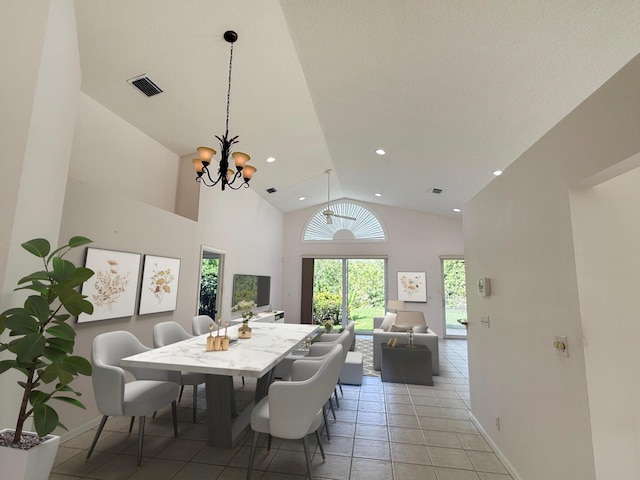 3190 SE Carrick Green Ct, Port Saint Lucie, FL 34952 - dining space featuring a chandelier, baseboards, light tile patterned floors, high vaulted ceiling, and recessed lighting