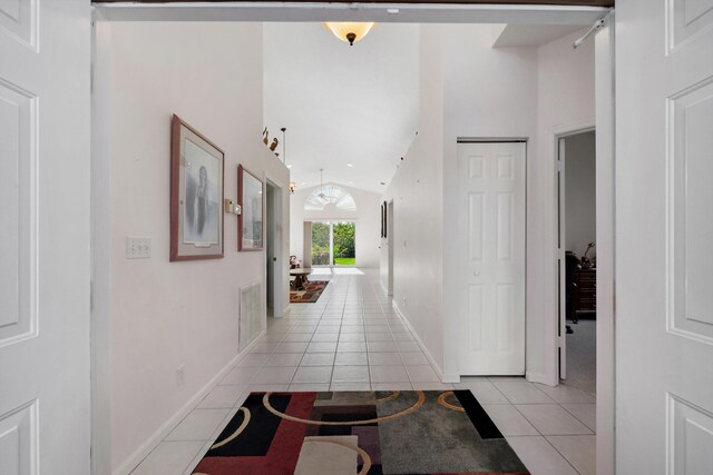 3190 SE Carrick Green Ct, Port Saint Lucie, FL 34952 - hallway featuring light tile patterned floors and lofted ceiling