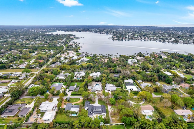 birds eye view of property featuring a residential view and a water view