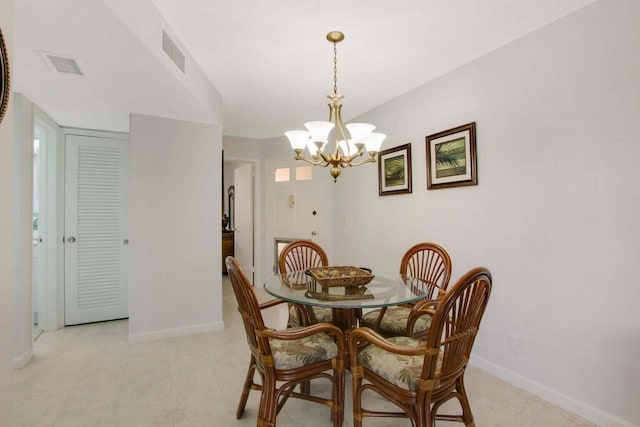 dining area featuring baseboards, visible vents, and a notable chandelier